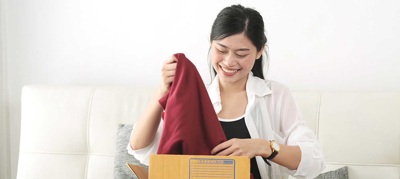 Woman happy with her online shopping spoils